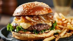 Ultimate Swiss Cheese Bacon Burger with Grilled Onions and Toasted Buns